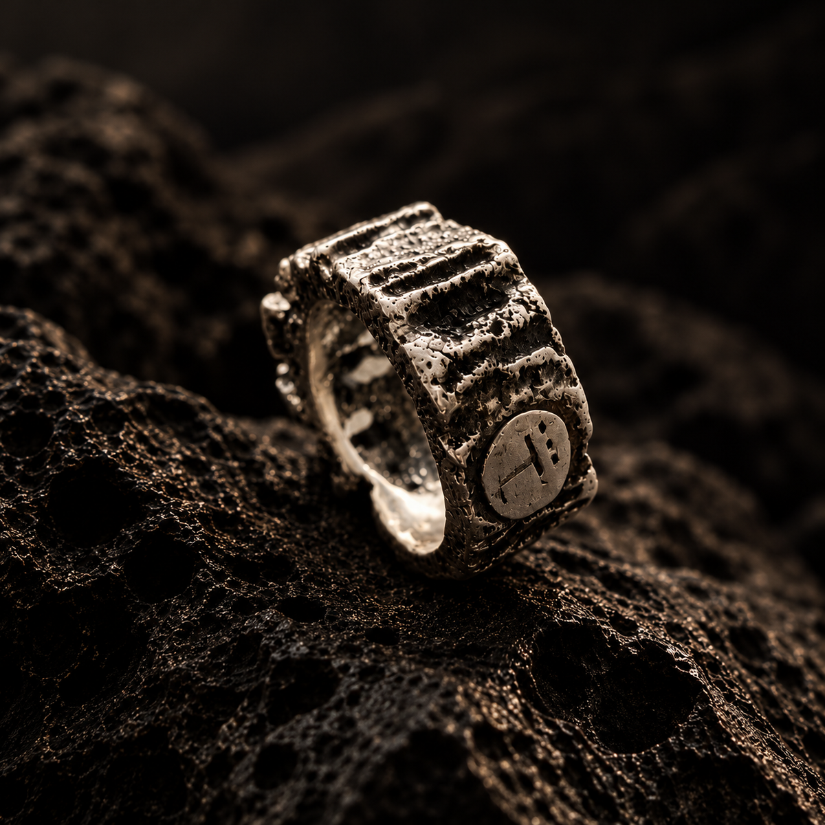 KRATOS ring in 950 silver, side view with textured surface and maker's mark