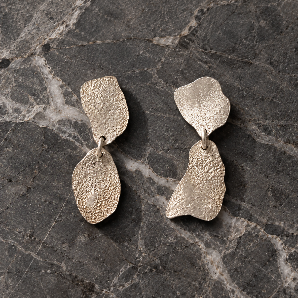 TERRES silver 950 sculptural earrings on dark grey marble — TULIPA
